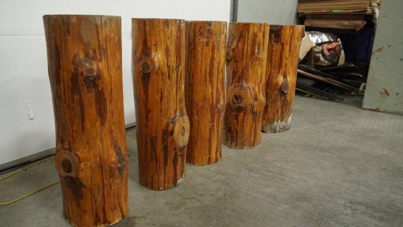 lot 95 image: Stained wood logs, used as table legs