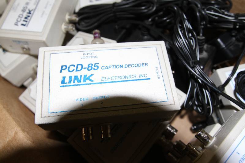 lot 76 image: Box of Miscellaneous Link Caption Decoders & Power Supplies