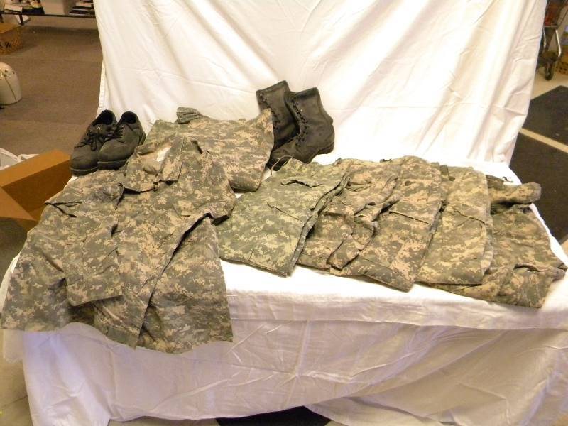 lot 59 image: Camo Clothing and Boots