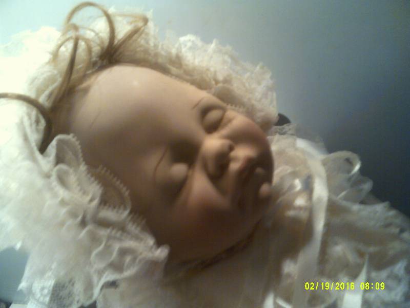 lot 50 image: WOODEN DOLL BED VINTAGE PORCELIAN DOLL