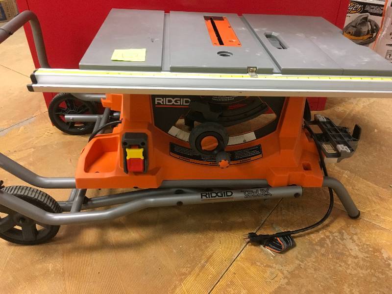 lot 42 image: Ridgid 15 Amp 10 in. Heavy-Duty Portable Table Saw with Stand missing guard used in good working condition