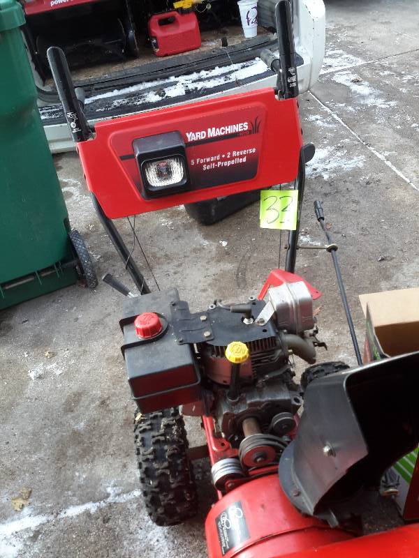 lot 33 image: Yard Machine  10 H.P. 24 in.. This one will run well with some reassembly.