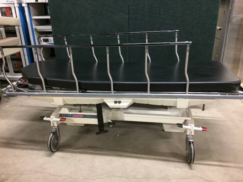 lot 4 image: Retail Used $3000 Hausted Unicare III 800 Series Hydraulic 500 lb Weight Capacity Multipurpose Surgical Stretcher EMT Gurney Hospital Transport Bed Free Used Mattress - Excellent Condition