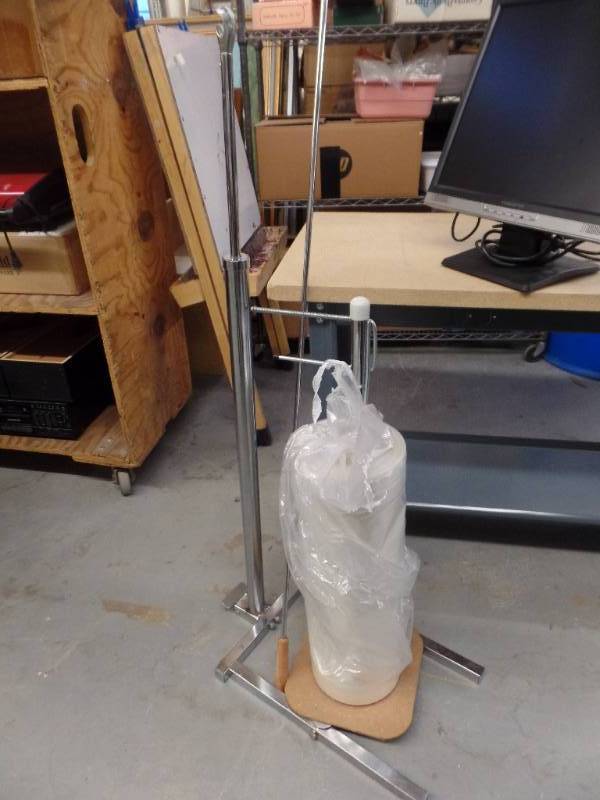 lot 443 image: GARMENT BAG RACK AND TABLE