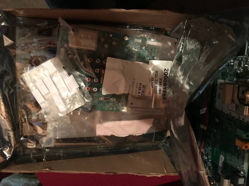 Four boxes of computer repair cables, power supplies and more.