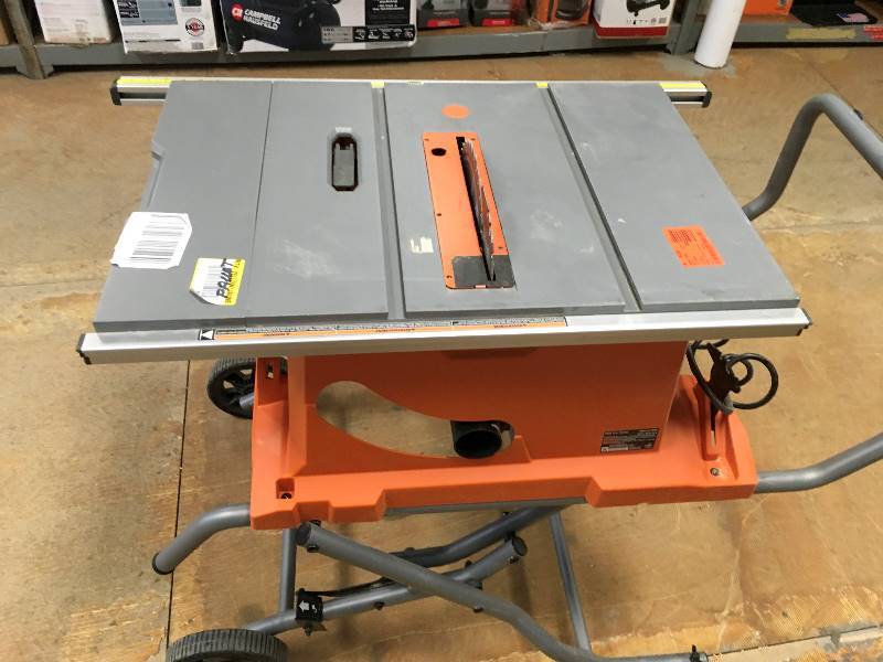 RIDGID  15 Amp 10 in. Heavy-Duty Portable Table Saw with Stand whit small damage in working conditions