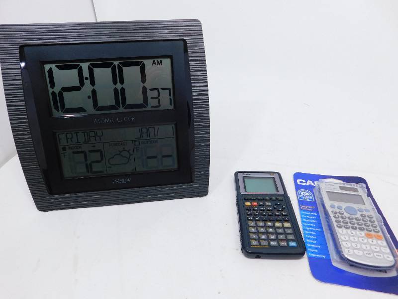 lot 65 image: 2 Calculators and Battery Operated Clock