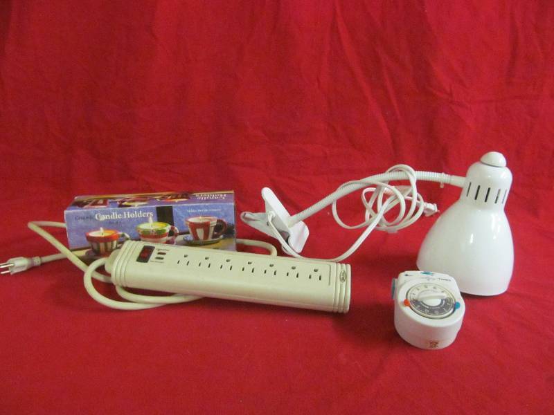 power strip, light, timer, candles
