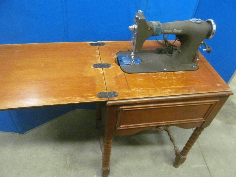 vintage Eldridge Rotary sewing machine in cabinet