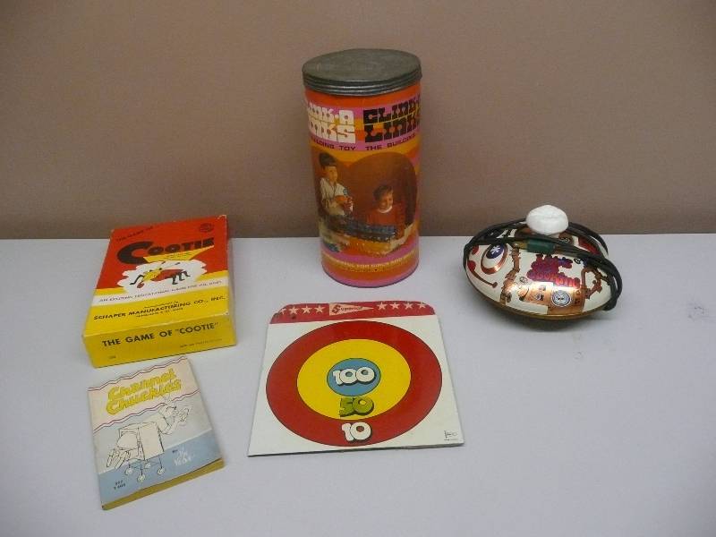 lot 24 image: COLLECTION OF VINTAGE TOYS - SUPERIOR MADE IN USA METAL TARGET WITH ORIGINAL CARDBOARD, USA MPLS MN COOTIE GAME - USA 1964 CHANNEL CHUCKLES BOOK - 1967 USA MATTEL LETS GET COOKING, USA CLINK A LINKS - SEE PICTURES