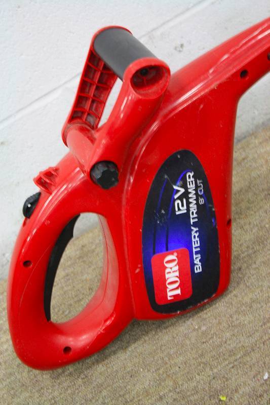 lot 97 image: Toro 12V 8 Battery Trimmer