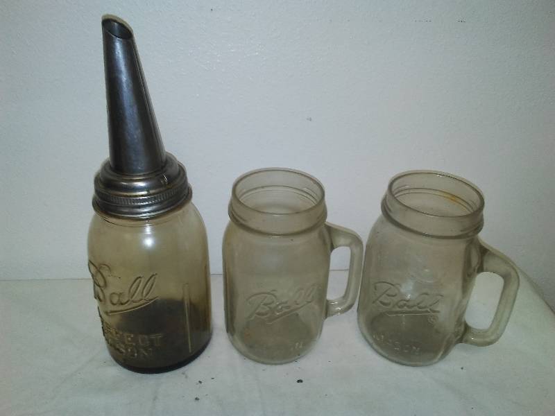 lot 27 image: Vintage Master Oil Spout, Mason Ball Quart jars with bail handles (3)