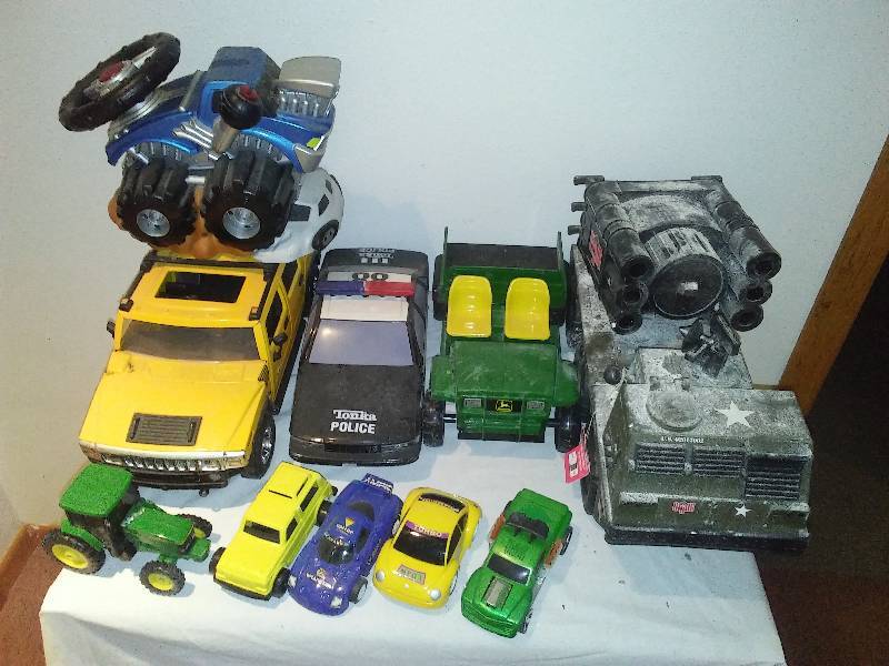 lot 128 image: John Deere, Hummer, GI Joe metal and plastic toys