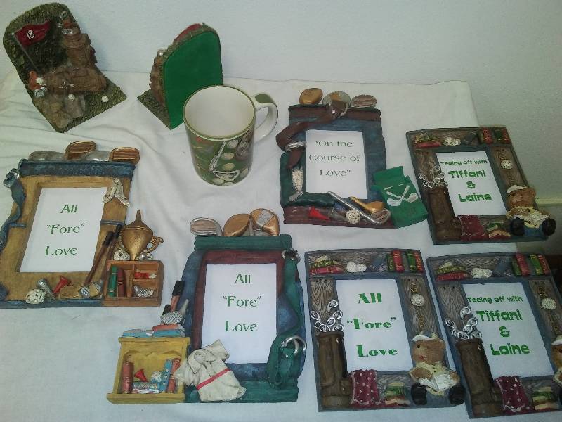 lot 98 image: Golf Mug, Book Ends, 6 picture frames