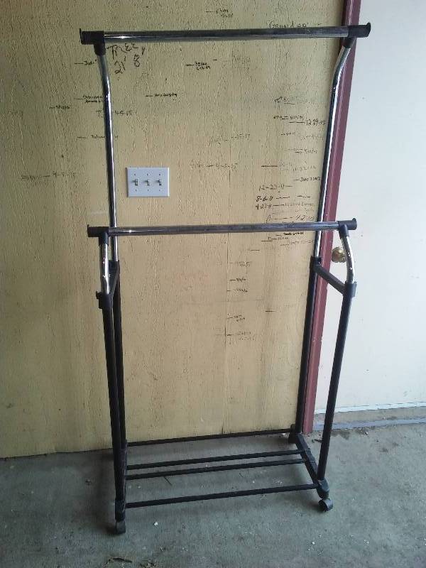lot 21 image: Portable and Adjustable Clothing Rack
