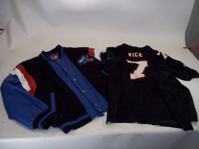 lot 97 image: Leather New York Giants Jacket Large  Vintage Michael Vick Jersey 2XL