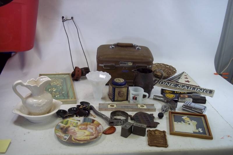 lot 182 image: Assortment of Vintage knick knacks of Vintage Leg brace, Boy scout Oath Plaque, Military tins, and much more.