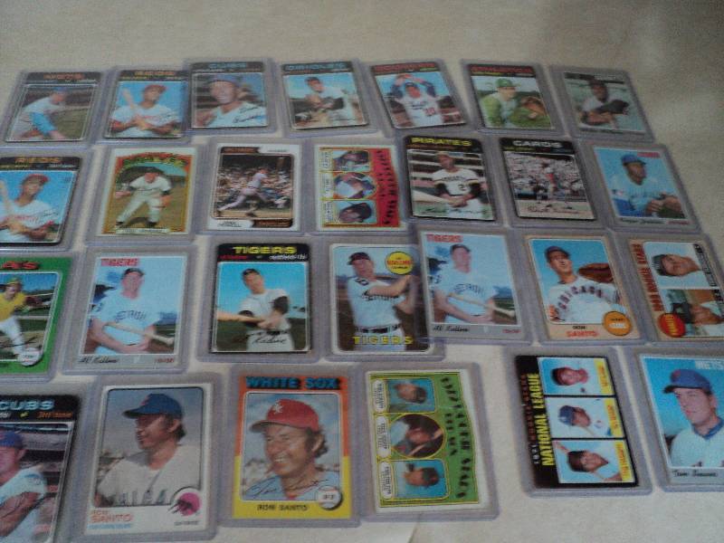 27 baseball cards in sleeves from 1...