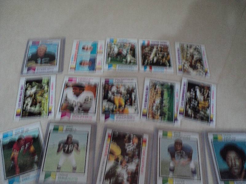 17 football cards in sleeves from 1...