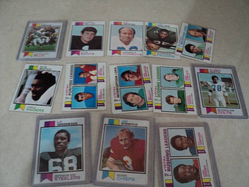 13 football cards in sleeves from 1...