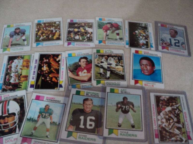 16  football cards in sleeves from ...