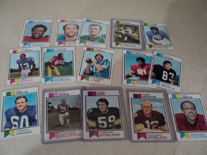 15 football cards in sleeves from 1...