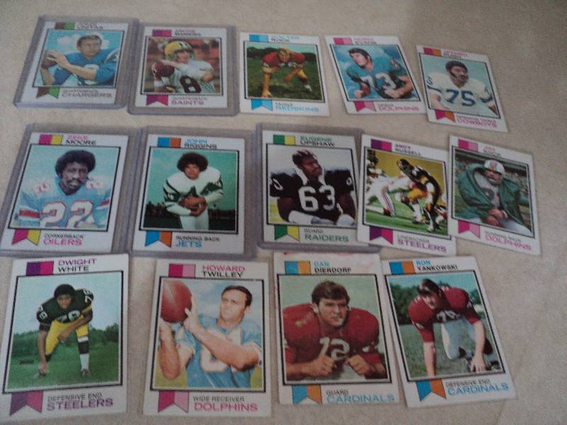 14  football cards in sleeves from ...