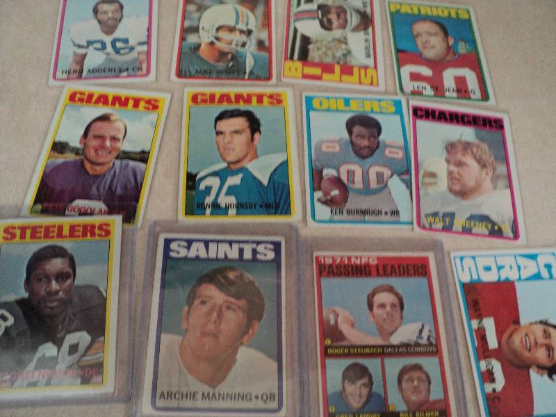 15 football cards in sleeves from 1...