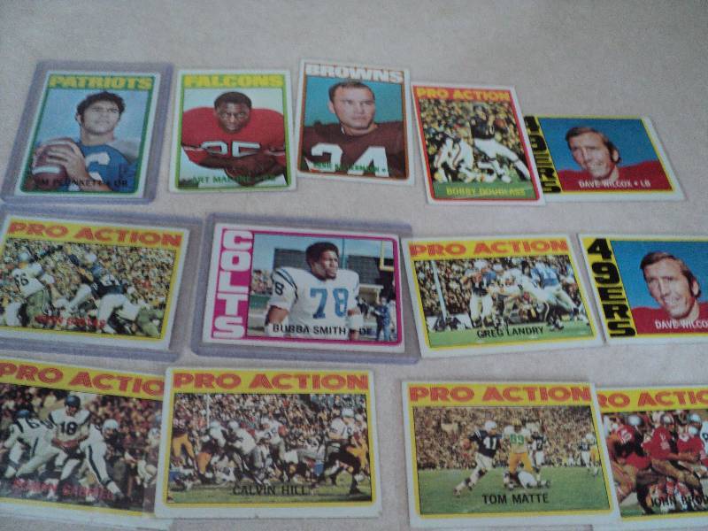 13 football cards in sleeves from 1...