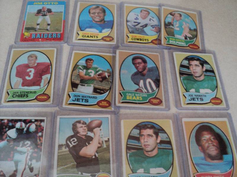 12 football cards in sleeves from 1...