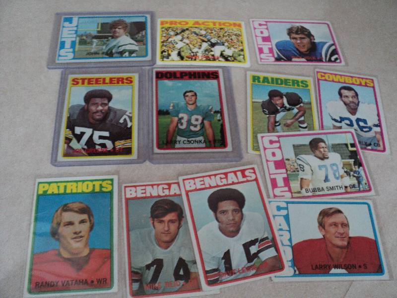 12 football cards in sleeves from 1...