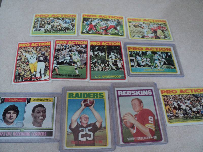 11 football cards in sleeves from 1...