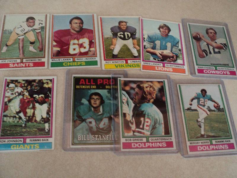 9 football cards in sleeves from 19...