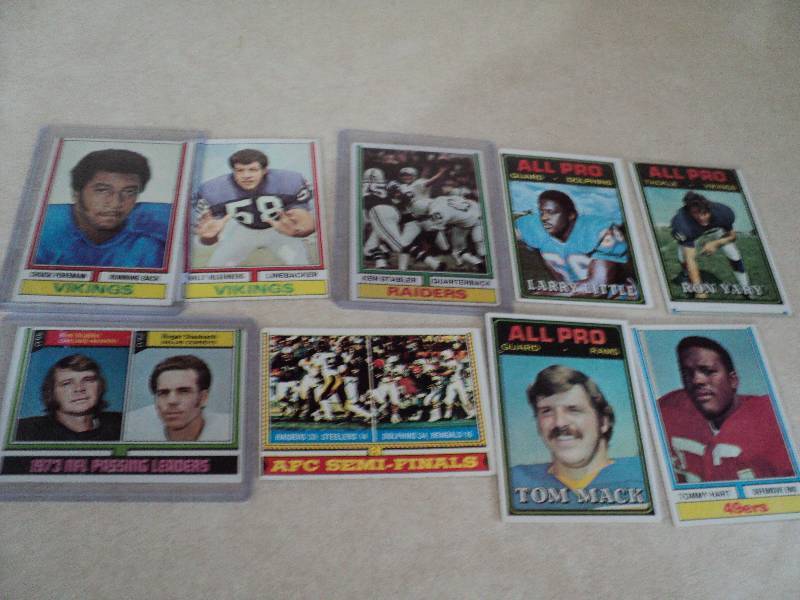 9 football cards in sleeves from 19...
