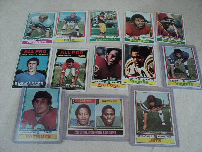 13 football cards in sleeves from 1...