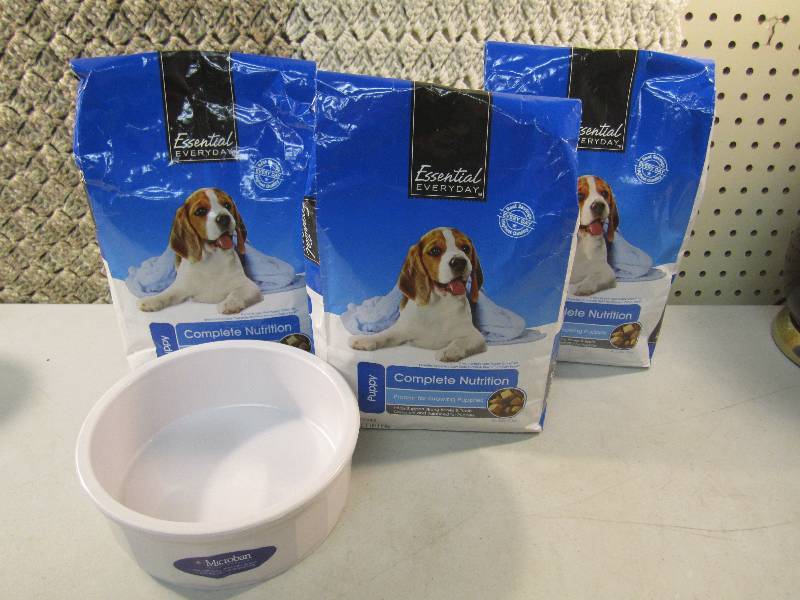lot 84 image: Lot of 3 Bags Puppy Food and a Food...