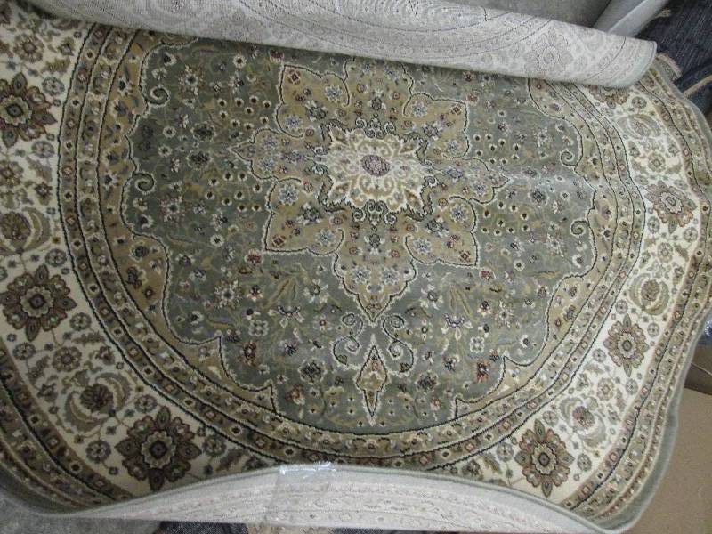 lot 100 image: Triumph Circular Rug 5 ft 3 inches...