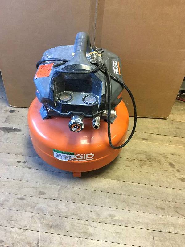 lot 3 image: Ridgid 6 Gal Portable Electric Pancake Compressor used in like new condition