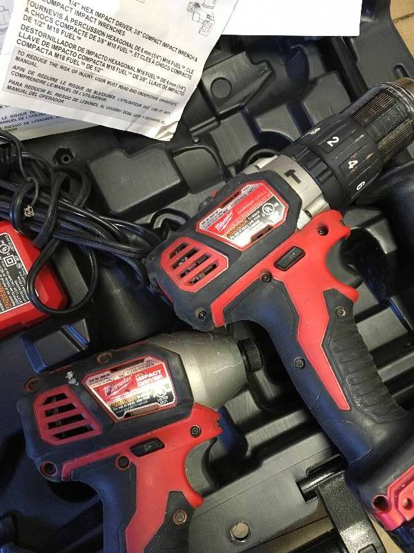 lot 8 image: Milwaukee M18 FUEL 18-Volt Cordless Brushless Surge Impact and Hammer Drill Combo Kit used in working condition