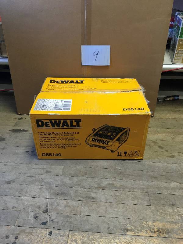 lot 9 image: Dewalt 1 Gal. Portable Electric Trim Air Compressor open box in like new condition