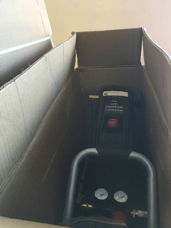 lot 15 image: Husky 8 Gallon Portable Oil Free Electric Air Compressor open box in good working condition