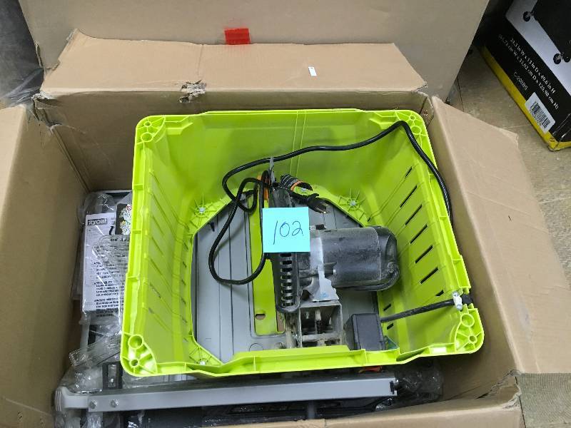 lot 102 image: Ryobi 10 Table SAw with Steel Stand used in very good working condition