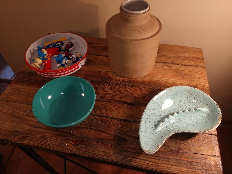 lot 16 image: Primitive Enamel Red and White Bowl, Smurf and Raisin Figure, Pottery, Blue Bowl and Ashtray
