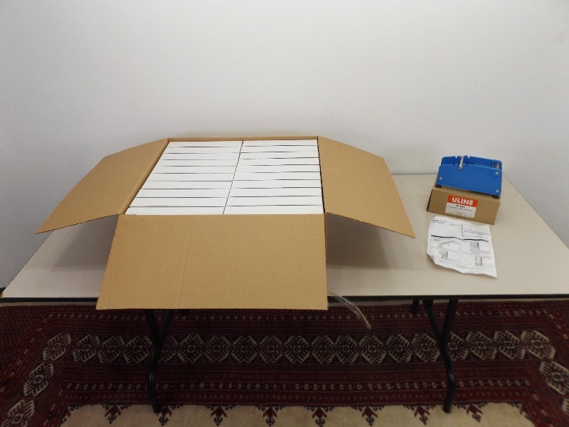 lot 31 image: New Uline T-shirt Boxes and Label Dispencer