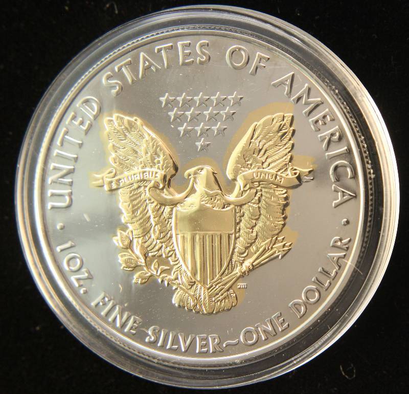 lot 27 image: 2008 AMERICAN SILVER EAGLE 1 TROY OZ. .999 FINE SILVER GOLD ENHANCED