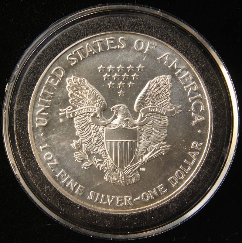 lot 102 image: 1999 AMERICAN SILVER EAGLE 1 TROY OZ. .999 FINE SILVER IN AIRTITE HOLDER