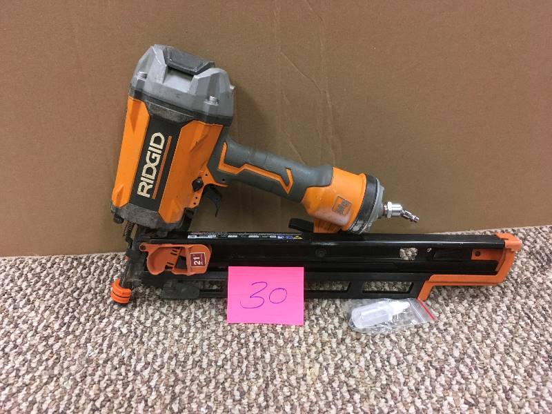 lot 30 image: - Ridgid 3-12 in. Round-Head Framing Nailer in working conditions