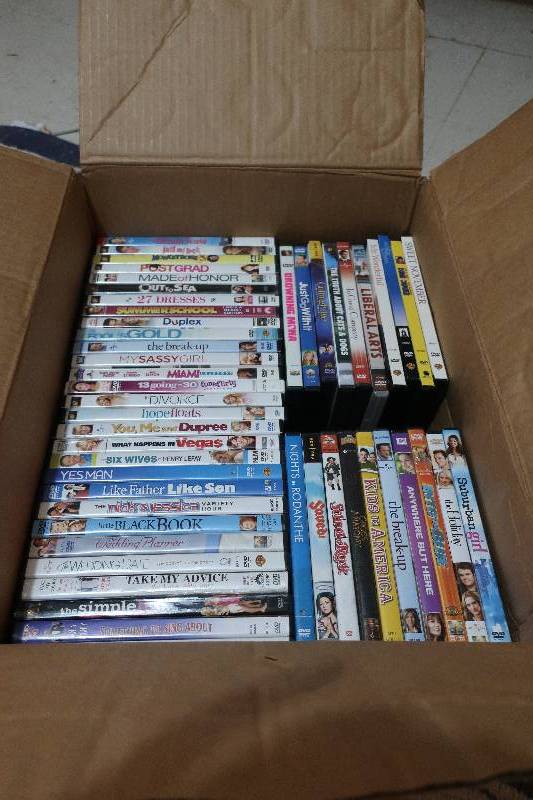 lot 37 image: BOX OF 50 DVDS