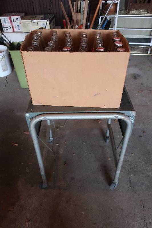 lot 104 image: METAL CART ON WHEELS, BOX OF nd CENTENNIAL COKE BOTTLES