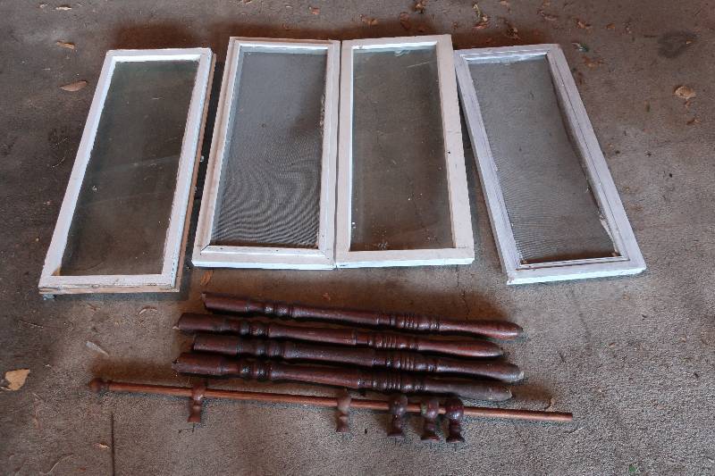 lot 115 image: WOODEN POSTS AND STORM WINDOWS